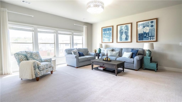 715 Laura Jean Ct, Buford, GA 30518 - carpeted living area featuring baseboards and a chandelier