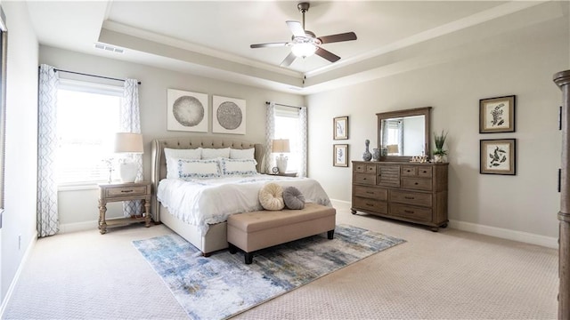 715 Laura Jean Ct, Buford, GA 30518 - bedroom with light colored carpet, a raised ceiling, baseboards, a ceiling fan, and ornamental molding