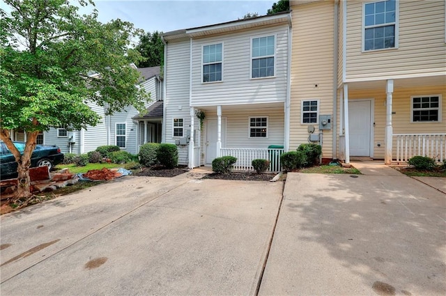 6344 Wellington Walk Way, Lithonia, GA 30058 - townhome / multi-family property featuring covered porch