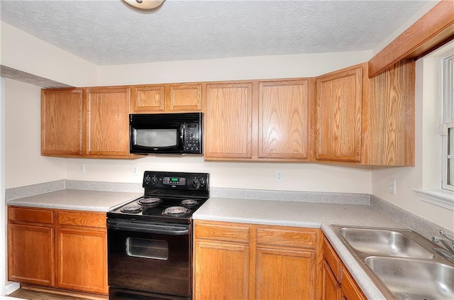 6344 Wellington Walk Way, Lithonia, GA 30058 - kitchen with black appliances, a sink, light countertops, and a textured ceiling