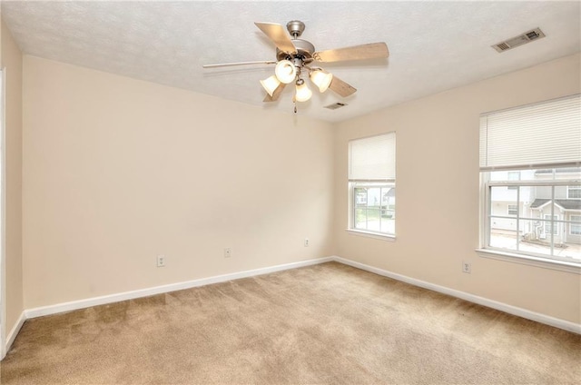 6344 Wellington Walk Way, Lithonia, GA 30058 - unfurnished room featuring light colored carpet, baseboards, a ceiling fan, and a textured ceiling