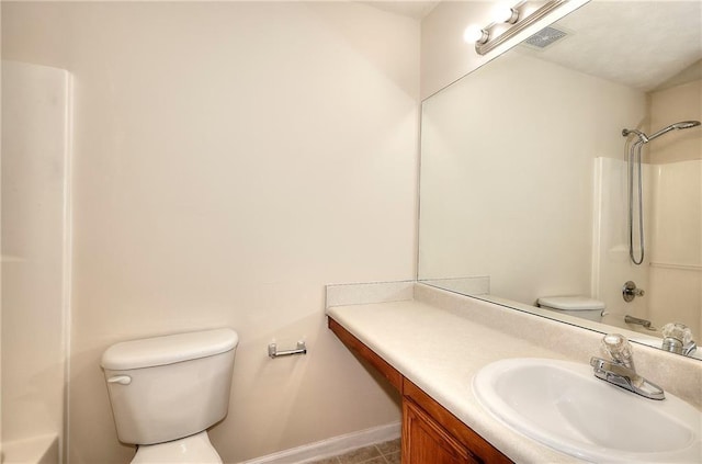 6344 Wellington Walk Way, Lithonia, GA 30058 - full bathroom featuring toilet, vanity, washtub / shower combination, baseboards, and tile patterned flooring