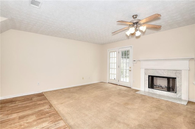 6344 Wellington Walk Way, Lithonia, GA 30058 - unfurnished living room featuring ceiling fan, a textured ceiling, a fireplace, baseboards, and wood finished floors