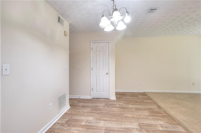 6344 Wellington Walk Way, Lithonia, GA 30058 - unfurnished dining area featuring a chandelier, baseboards, and light wood-style floors