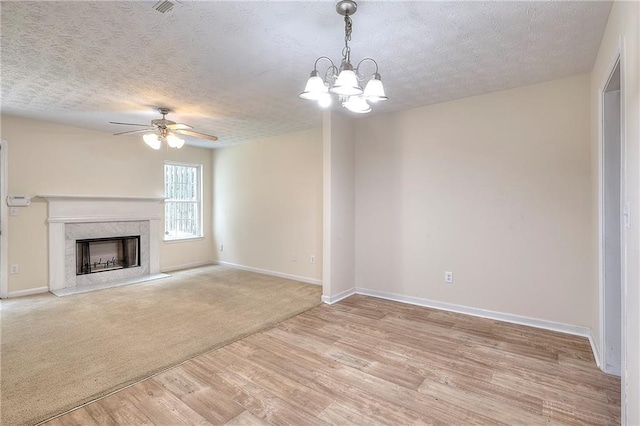 6344 Wellington Walk Way, Lithonia, GA 30058 - unfurnished living room featuring ceiling fan, a textured ceiling, light wood-style flooring, baseboards, and a fireplace