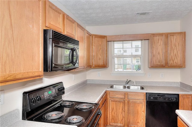 6344 Wellington Walk Way, Lithonia, GA 30058 - kitchen featuring black appliances, a sink, light countertops, and a textured ceiling