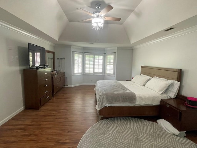 bedroom with ceiling fan, vaulted ceiling, and dark hardwood / wood-style flooring