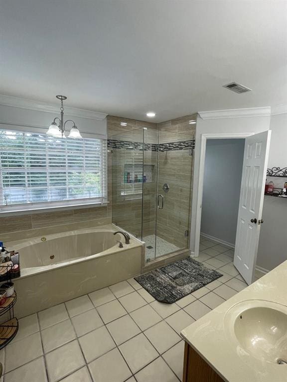 bathroom featuring shower with separate bathtub, tile patterned floors, vanity, ornamental molding, and an inviting chandelier