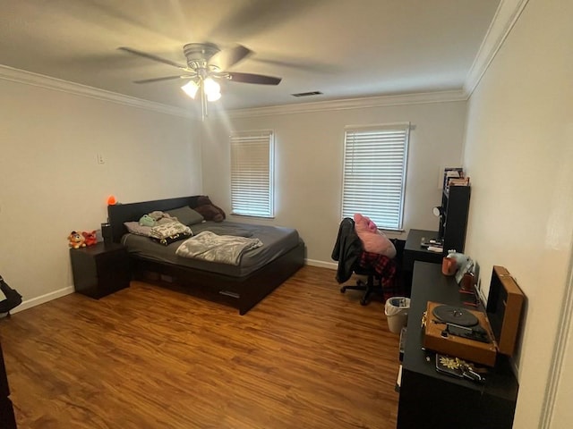 bedroom with ceiling fan, hardwood / wood-style flooring, and crown molding