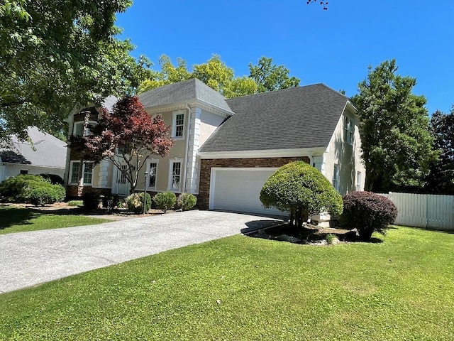 view of front facade featuring a front yard and a garage