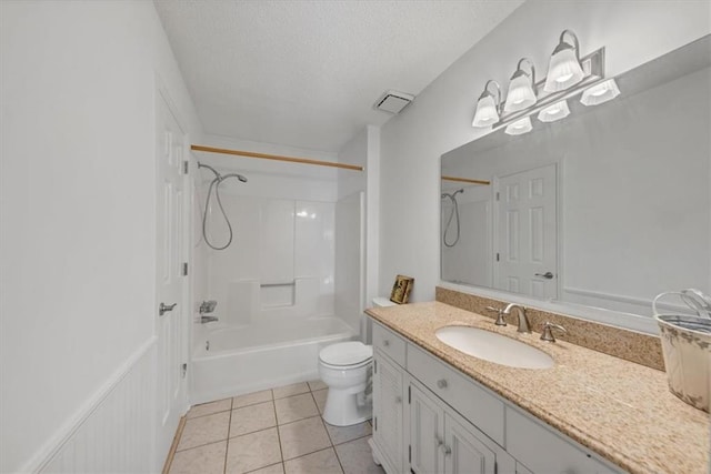 full bathroom featuring tile patterned floors, a textured ceiling, vanity, shower / washtub combination, and toilet