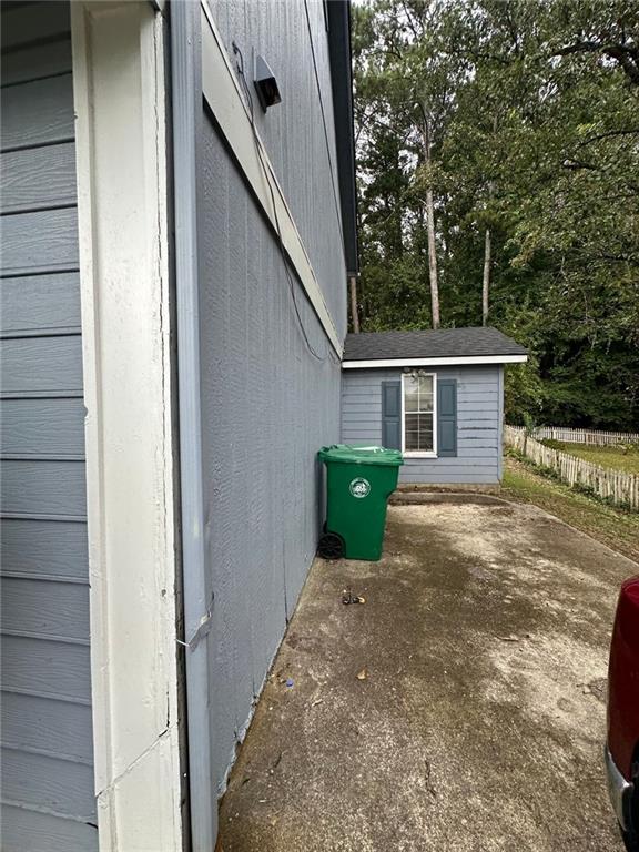 view of side of property featuring a patio area