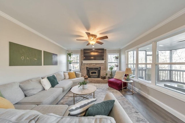 living room featuring hardwood / wood-style flooring, ceiling fan, and ornamental molding