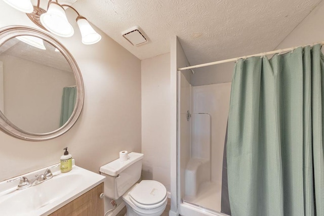 bathroom with a shower with shower curtain, vanity, a textured ceiling, and toilet