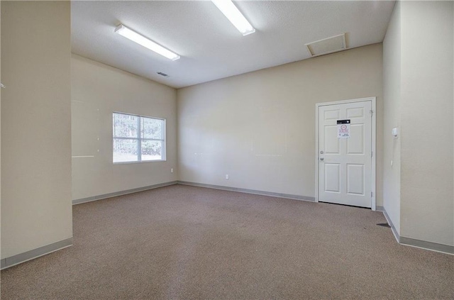 1195 Grady Rd, Rockmart, GA 30153 - carpeted empty room with baseboards and attic access