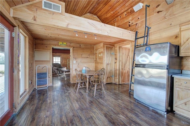 1195 Grady Rd, Rockmart, GA 30153 - dining space with wood ceiling, lofted ceiling, wood walls, and dark wood finished floors