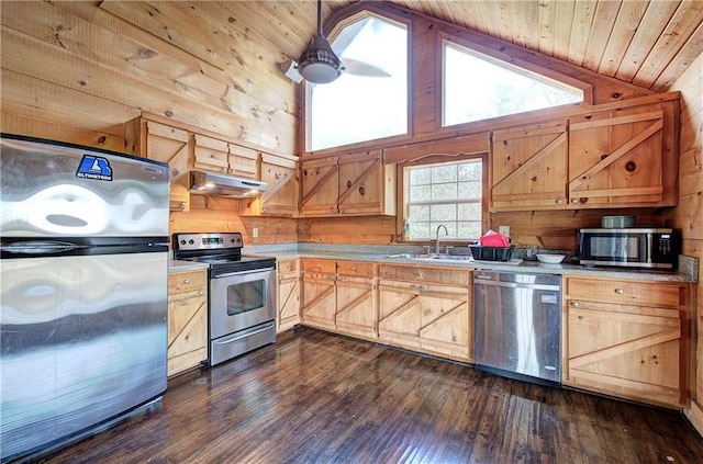 1195 Grady Rd, Rockmart, GA 30153 - kitchen featuring stainless steel appliances, wood walls, a sink, light countertops, and under cabinet range hood