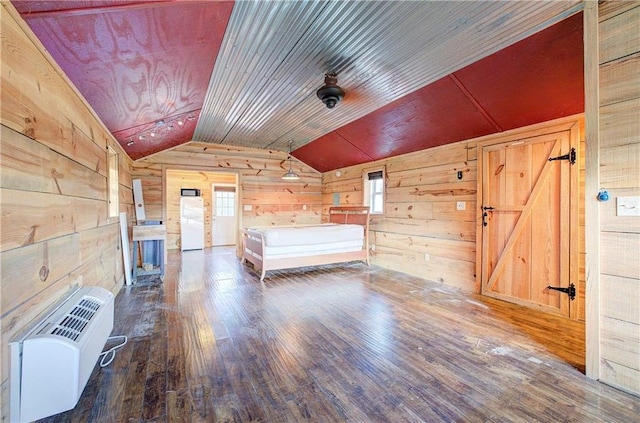 1195 Grady Rd, Rockmart, GA 30153 - unfurnished bedroom with wood walls, lofted ceiling, multiple windows, wood finished floors, and heating unit