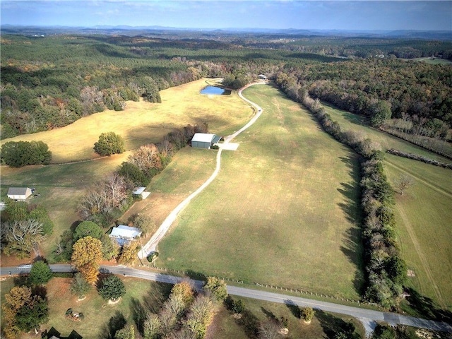 1195 Grady Rd, Rockmart, GA 30153 - aerial view of property and surrounding area with a heavily wooded area