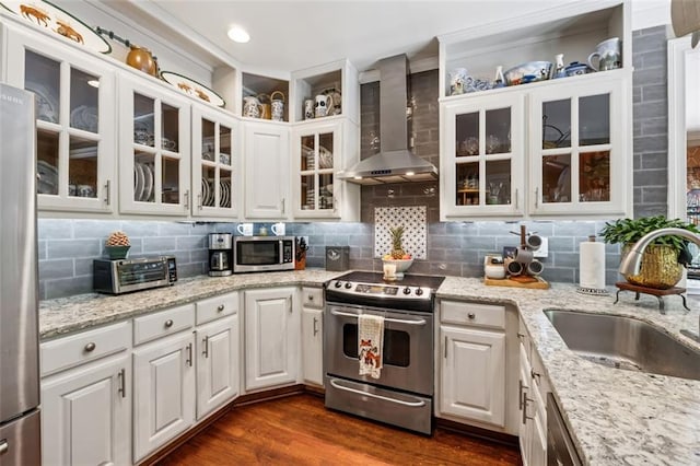 1042 Bailey Rd, Woodstock, GA 30188 - kitchen featuring wall chimney range hood, stainless steel appliances, dark wood-style floors, white cabinets, and backsplash