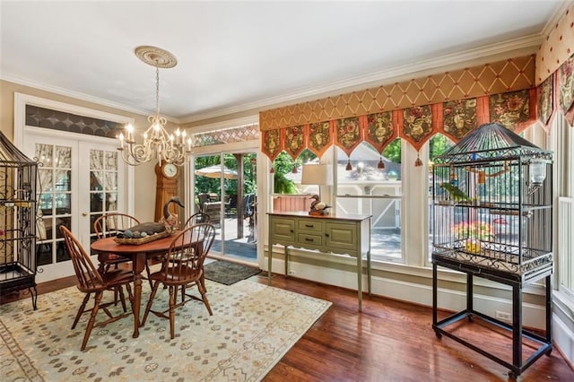 1042 Bailey Rd, Woodstock, GA 30188 - dining room with ornamental molding, a chandelier, wood finished floors, and french doors