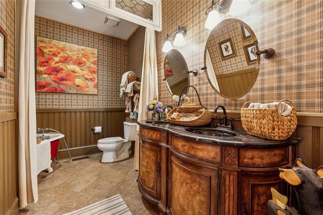 1042 Bailey Rd, Woodstock, GA 30188 - bathroom featuring wallpapered walls, a wainscoted wall, and vanity