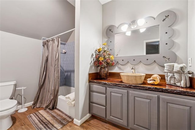 1042 Bailey Rd, Woodstock, GA 30188 - bathroom with vanity, shower / tub combo, wood finished floors, and lofted ceiling