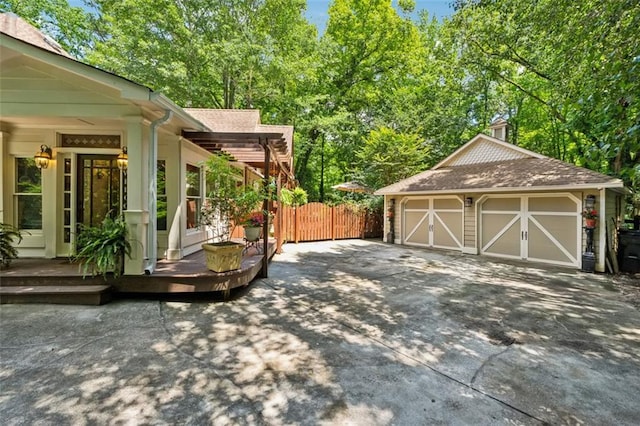 1042 Bailey Rd, Woodstock, GA 30188 - view of patio featuring an outdoor structure and a garage