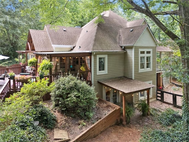 1042 Bailey Rd, Woodstock, GA 30188 - rear view of house with a shingled roof and a wooden deck