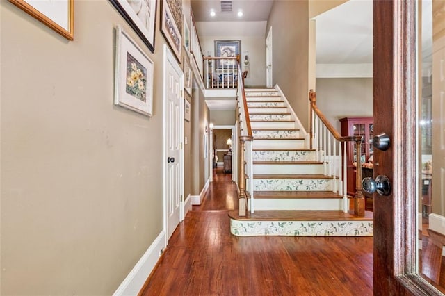 1042 Bailey Rd, Woodstock, GA 30188 - foyer with stairway and wood finished floors