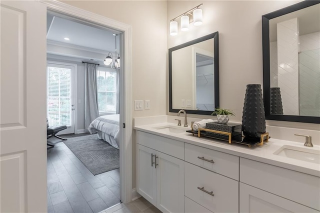 bathroom featuring ornamental molding, vanity, wood-type flooring, and a shower