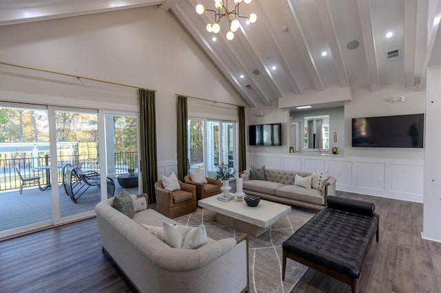 living room with hardwood / wood-style flooring, high vaulted ceiling, beam ceiling, and a notable chandelier