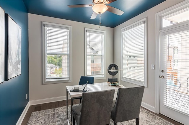 dining area featuring ceiling fan and dark hardwood / wood-style floors