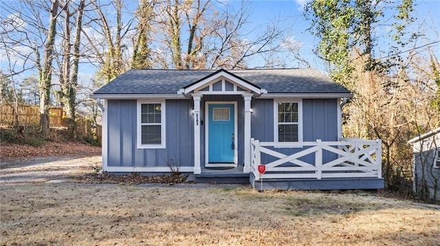 bungalow-style house with a front lawn