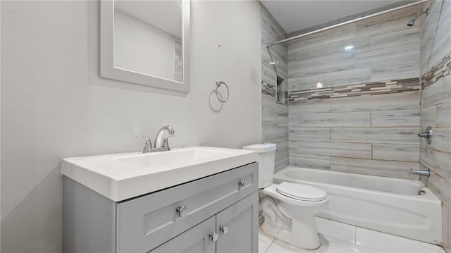 full bathroom with vanity, tiled shower / bath, and toilet