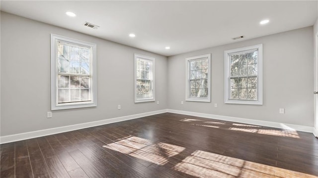 spare room featuring dark hardwood / wood-style floors