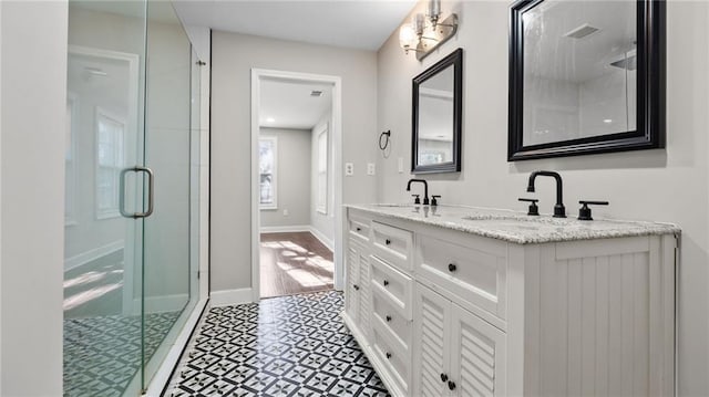 bathroom with vanity and an enclosed shower