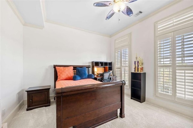 bedroom featuring crown molding, visible vents, a ceiling fan, carpet flooring, and baseboards