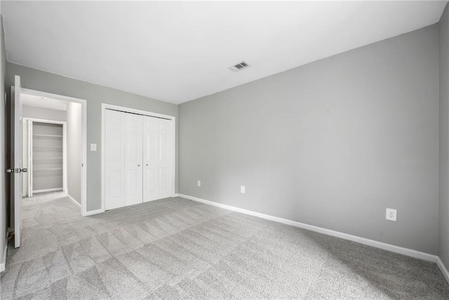 23307 Plantation Dr NE, Atlanta, GA 30324 - unfurnished bedroom with baseboards, carpet, and a closet