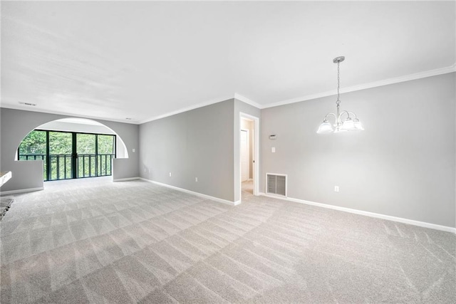 23307 Plantation Dr NE, Atlanta, GA 30324 - unfurnished living room with ornamental molding, baseboards, a chandelier, and carpet