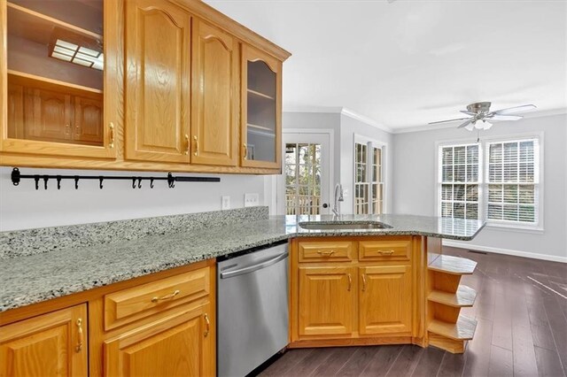 kitchen featuring a peninsula, dark wood-style floors, ceiling fan, stainless steel dishwasher, and a sink