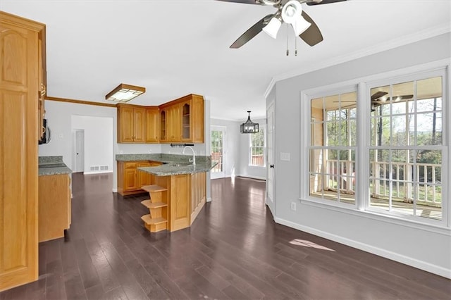 kitchen with visible vents, baseboards, open shelves, crown molding, and dark wood-type flooring