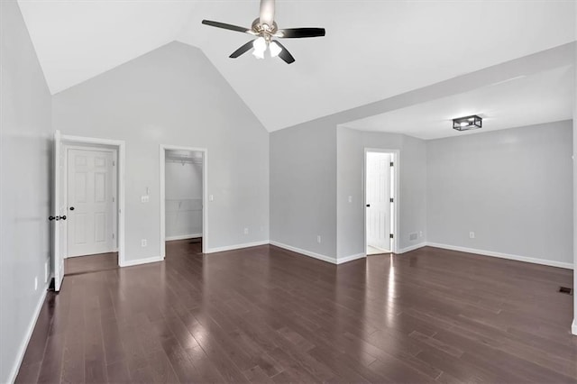 unfurnished living room featuring ceiling fan, baseboards, dark wood finished floors, and lofted ceiling