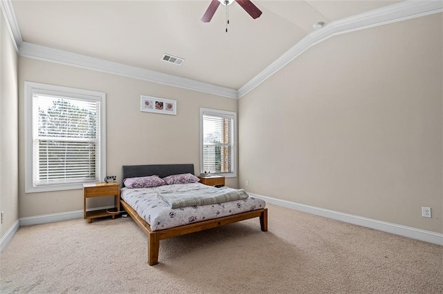 bedroom with carpet, visible vents, crown molding, and lofted ceiling