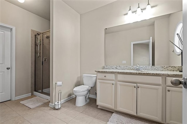 full bathroom with a stall shower, baseboards, toilet, tile patterned flooring, and vanity