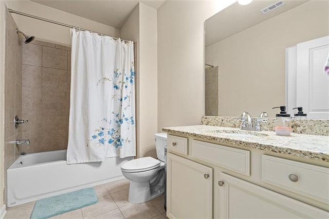 bathroom with tile patterned flooring, toilet, vanity, visible vents, and shower / tub combo with curtain