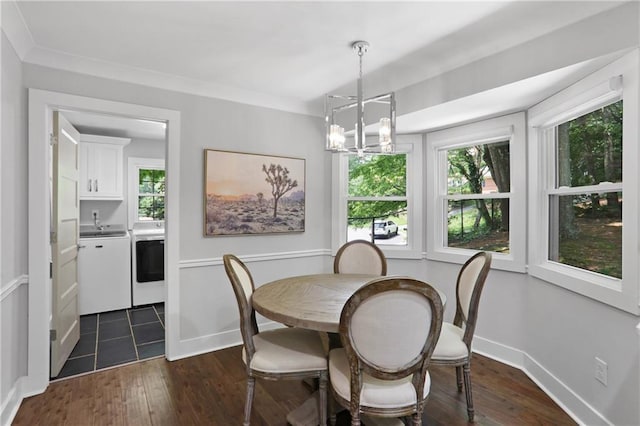 2445 Kings Point Dr, Dunwoody, GA 30338 - dining area with washer / clothes dryer, a chandelier, and healthy amount of natural light