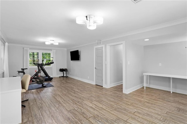 2445 Kings Point Dr, Dunwoody, GA 30338 - workout area with crown molding, light wood-type flooring, and baseboards