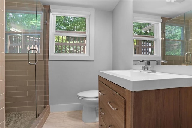 2445 Kings Point Dr, Dunwoody, GA 30338 - bathroom featuring vanity, toilet, a stall shower, and baseboards