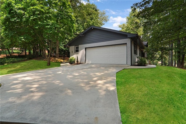 2445 Kings Point Dr, Dunwoody, GA 30338 - view of front of house with driveway, a front lawn, a garage, and brick siding